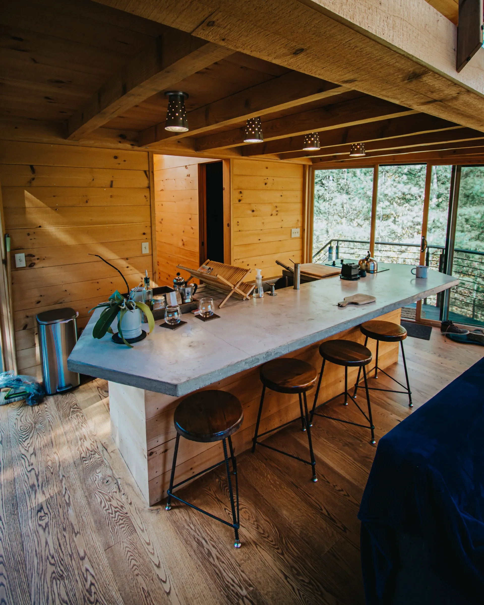 Full kitchen with island and exposed cedar beams