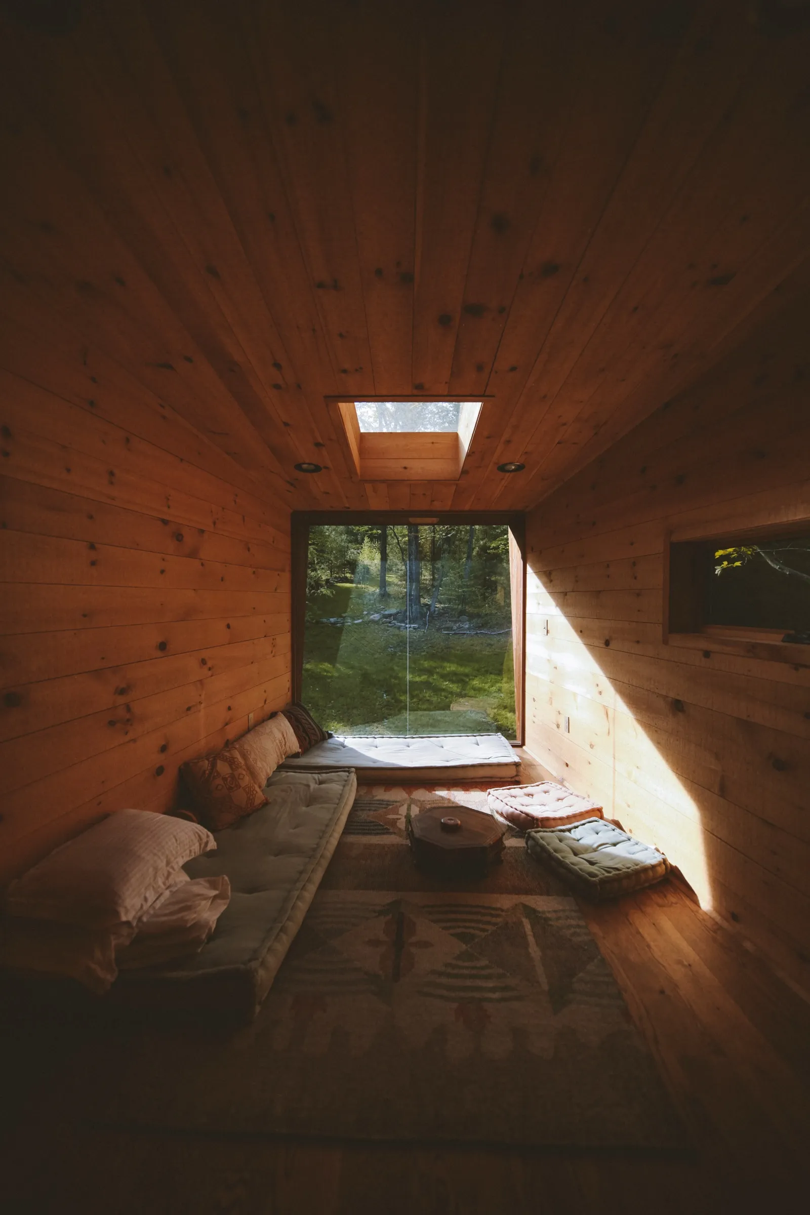 Loft bedroom with window to the forest